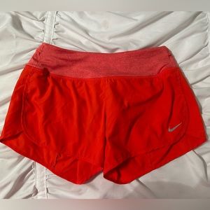 red nike shorts